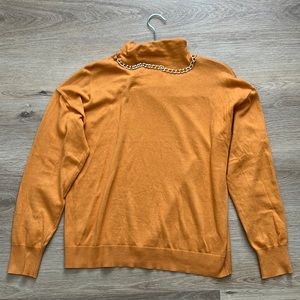 Michael Kora L mock neck sweater with chain detail